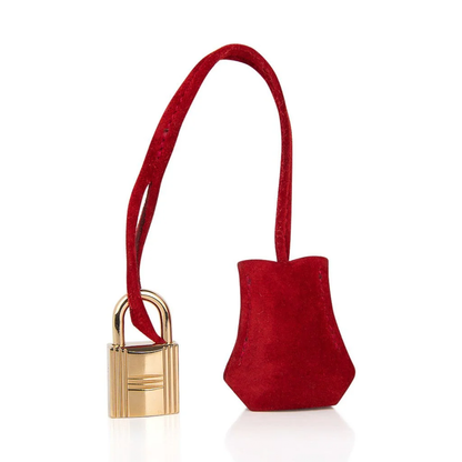 Rich Fiery Crimson Matte Velvety Suede Compact Structured Hand Tote With Lustrous Golden Twist Lock Hardware, Matching Suspended Suede Tag And Striped Metal Padlock Charm