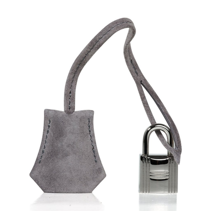 Soft Smoke Grey Matte Plush Suede Compact Structured Hand Tote With Tonal Fine Stitching, Polished Silvery Twist Lock Hardware And Matching Suspended Suede Tag Striped Metal Padlock Charm