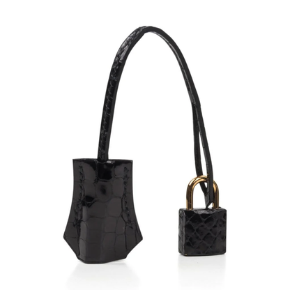 High Gloss Jet Black Large Defined Scale Embossed Compact Structured Hand Tote With Polished Golden Twist Lock Hardware, Matching Suspended Embossed Tag And Square Padlock Charm